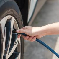 Person filling up their tire